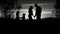 Silhouetted family captures a stunning moment of love and play