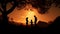 Silhouetted family plays and laughs together in nature\\\'s beauty