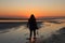 Silhouetted Girl Watching a Sunset at a Cape Cod Beach