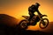 Silhouetted motocross bike defies gravity, embodying adventure and daring action