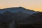 Silhouetted mountain range after sunset