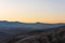 Silhouetted mountain range after sunset