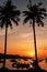 Silhouetted palm trees and boats at sunrise on Ao Ton Sai, Phi P