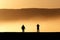 Silhouetted people at the sunset