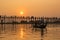 Silhouetted people on U Bein Bridge