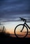 Silhouetted race bike in sunset