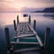 Silhouetted rowing boat on Lake Garda, Italy