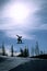 Silhouetted Snowboarder Jumping