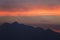 Silhouetted sunset sky with the mountains.beautiful orange clouds after sunset for background