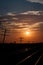 Silhouetted Telegraph Lines at Sunrise