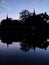 Silhouetted of temple with a water reflection