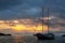 Silhouetted tourist sailboat at sunrise anchored near Chinese Ha