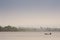 Silhouetted traditional wooden canoes fishing in Asia