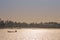 Silhouetted traditional wooden canoes fishing in Asia