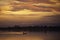 Silhouetted traditional wooden canoes fishing in Asia