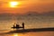 Silhouetted of travellers in the beach at Krabi, Thailand.