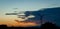 Silhouetted Wind Turbine at Sunset