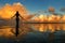 Silhouetted woman standing in a water at sunset on Taveuni Island, Fij