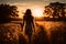 Silhouetted Young Woman Walks Into Beautiful Sunset