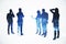 Silhouettes of abstract businesspeople standing on illuminated white city background. Teamwork and success concept. Double