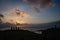 Silhouettes of Ahu Tahai moai in Hanga Roa, Easter Island during sunset