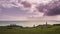 Silhouettes of Ahu Tahai moai in Hanga Roa, Easter Island during sunset