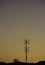 Silhouettes of antennas at orange sunset