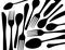 Silhouettes of black forks and spoons on white background