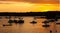 Silhouettes of boats at sunset