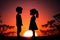 Silhouettes of a boy and a girl against the backdrop of a sunset. Valentines Day concept.