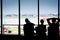 Silhouettes of businessman and passengers traveling on airport,