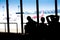 Silhouettes of businessman and passengers traveling on airport,