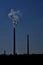 Silhouettes of chimneys with fog