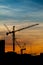 Silhouettes of construction crane