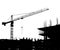 Silhouettes of a construction crane