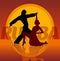 Silhouettes of couple dancing latin dance