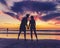 Silhouettes of couple in love kissing at beach sunset celebrating freedom and love