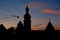 Silhouettes of evening Lviv. View on Hlyniany Gate and Bernardine church. Ancient city walls