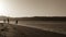 Silhouettes of fishermen at dawn.