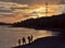 Silhouettes of fishermen at evening sunset