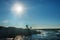 Silhouettes of fishermen on the rocks catch fish on the shores of the Atlantic Ocean. USA. Maine. Acadia National Park.