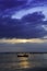 Silhouettes Fishing boats at the beach in the evening