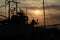 Silhouettes fishing boats at sea in sunset.