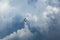 Silhouettes of four Su-30 SM, russian fighter aircrafts high in the blue cloudy sky