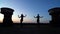 Silhouettes of girls performing on roof at night