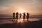 silhouettes of a group of friends running towards the sea at sunset.generative ai