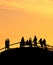 Silhouettes group people sunset park