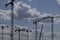 Silhouettes of a group of tower cranes with clouds