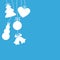 Silhouettes of hanging Christmas baubles on blue background