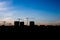 Silhouettes high-rise buildings under construction on background of the blue sky